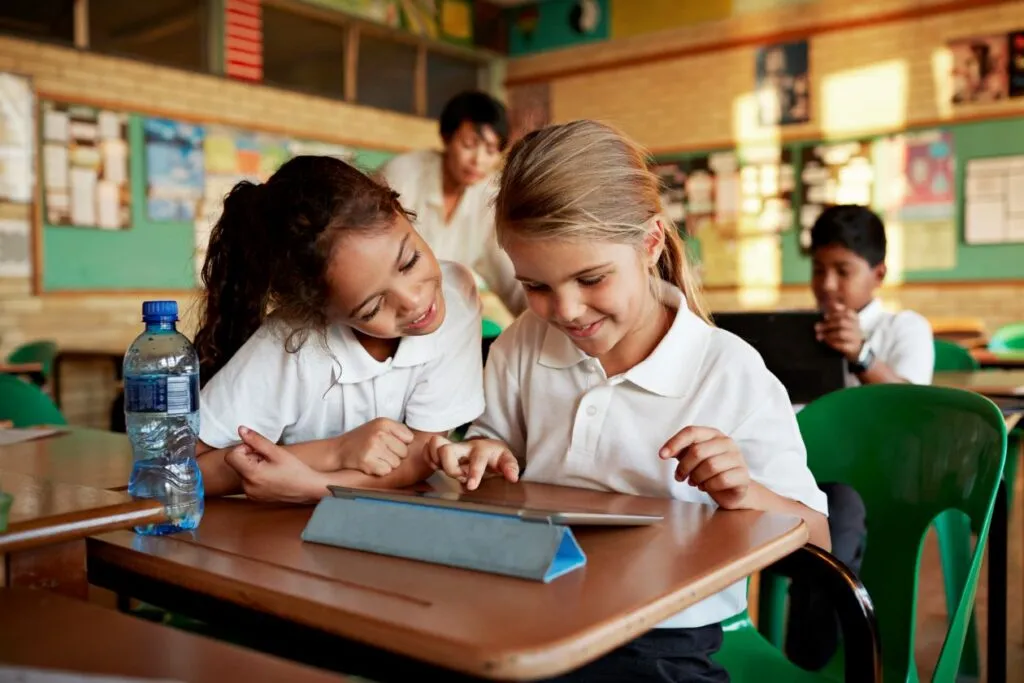 Students playing Minecraft together in a classroom